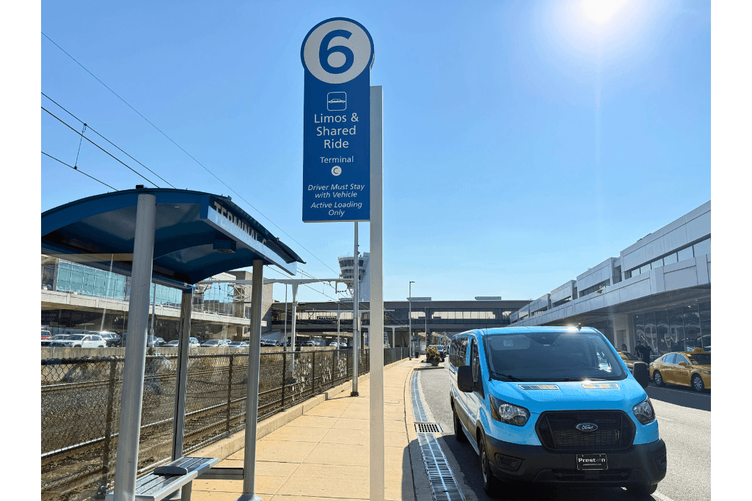 Zone 6 pickup area outside PHL terminal with covered waiting area for shuttles